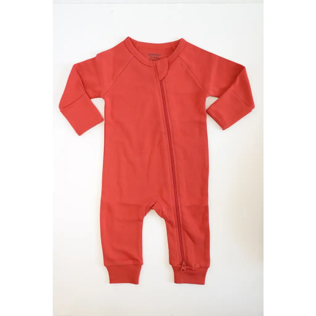 Red long-sleeved zippered baby romper in organic cotton for cozy comfort