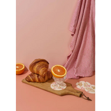 Golden-brown croissants on wooden board with Oui Croissants Coasters polished prints