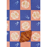 Flaky golden-brown croissant on Oui Croissants Coasters with stylish prints for moms