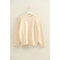 Cream-colored oversized drop shoulder sweater with ribbed cuffs