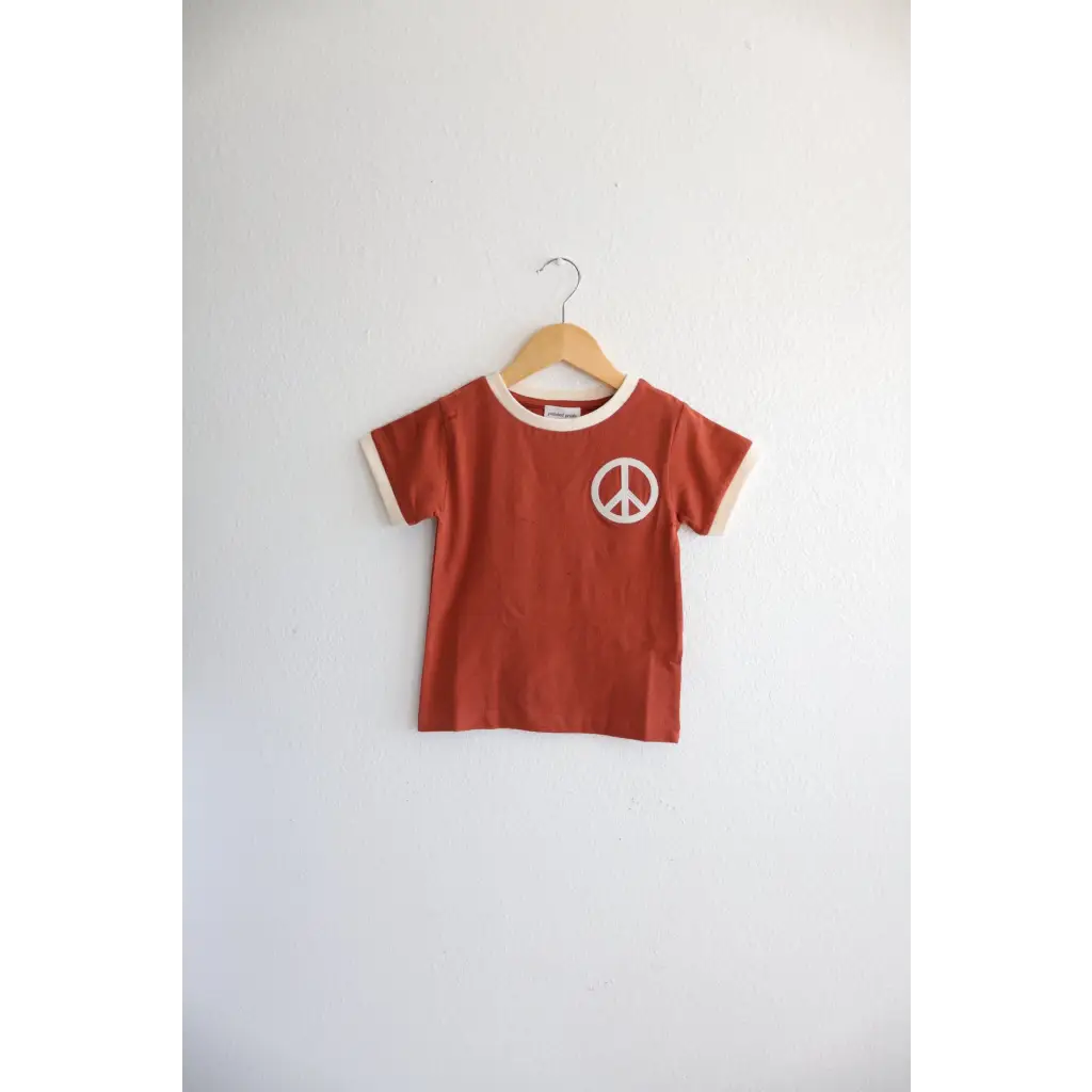 Rust Peace Embroidered Ringer Tee for Kids on hanger, a stylish everyday ringer option
