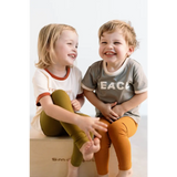 Two laughing kids in casual clothes wearing Everyday Ringer Tee for a fun vibe