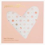 White heart nail stickers with pink dots and gold peace symbols for Groovy Baby vibes