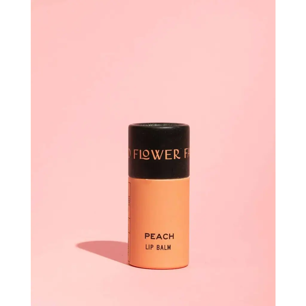 Peach organic lip balm in sleek tube with polished prints, 0.3 oz