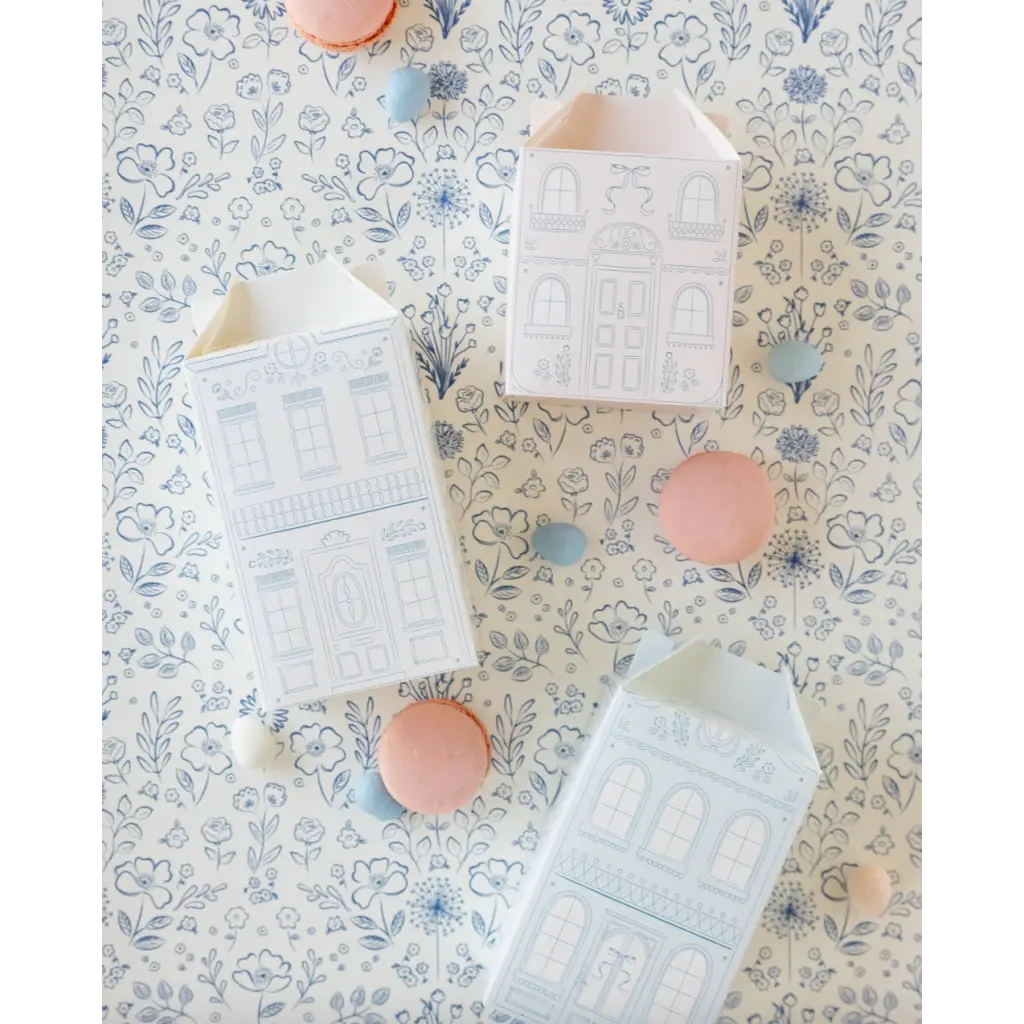 House-shaped gift boxes featuring architectural drawings on Pembroke Floral Paper Table Runner