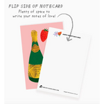 Notecard with champagne and strawberry design, perfect for polished prints lovers