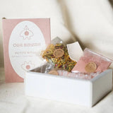 Petite Rituals white gift box with pink gold accents, herbal tea and bath salts