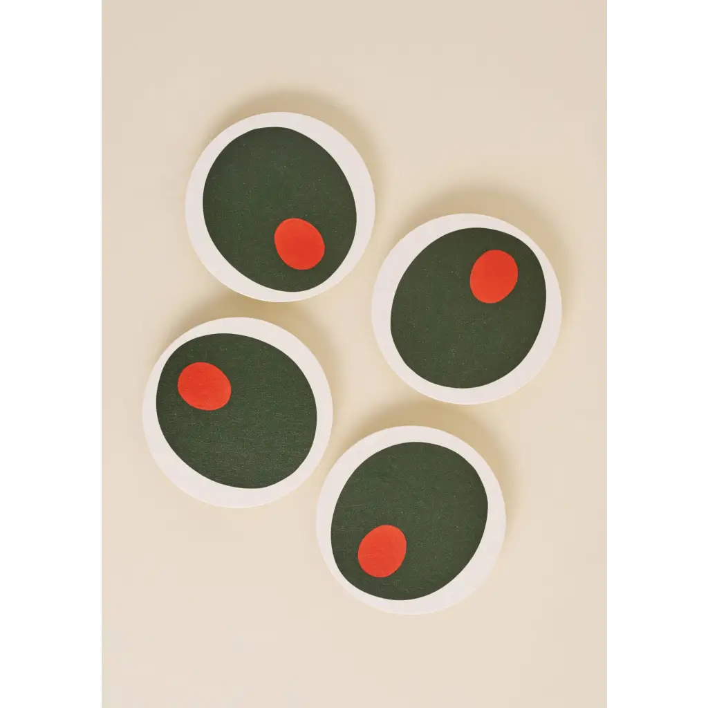 Four stylish Pimento Olive Coasters with polished prints and dark green centers