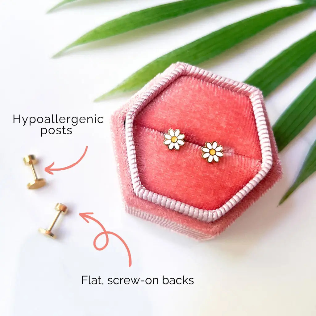 Gold daisy stud earrings in pink velvet box, chic for moms stylish looks