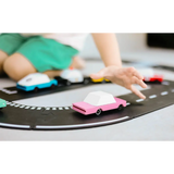 Pink Sedan toy car on black track, made of solid beech wood with clear urethane coat