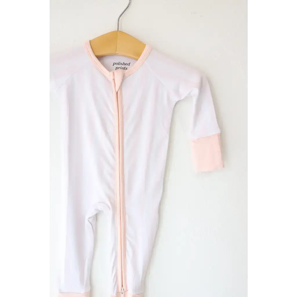 White baby onesie with pink trim in Pink Striped Bamboo Baby Sleeper perfect for comfy bamboo baby comfort