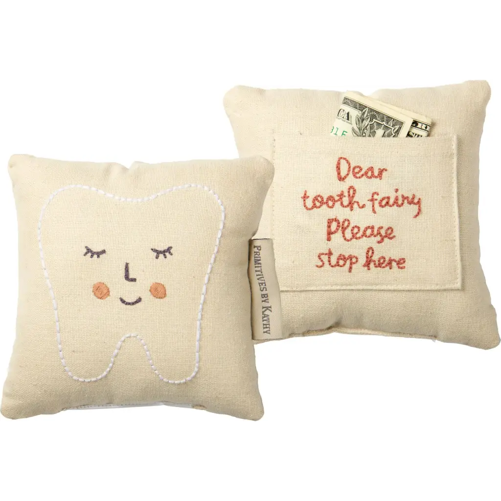 Cream-colored tooth fairy pillow with embroidered face and pocket, perfect fairy pillow