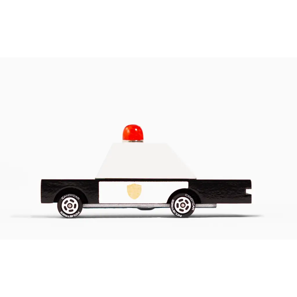 Black and white police car toy in solid beech wood with clear urethane coat and light