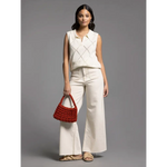 Woman in Posie Collared Sleeveless Knit Top with wide-leg pants, stylish womens clothes