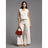 Woman in Posie Collared Sleeveless Knit Top with wide-leg pants, stylish womens clothes