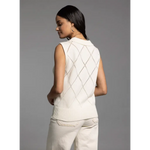 Woman wearing cream-colored argyle sweater vest from Posie Collared Sleeveless Knit Top, perfect for stylish womens clothes