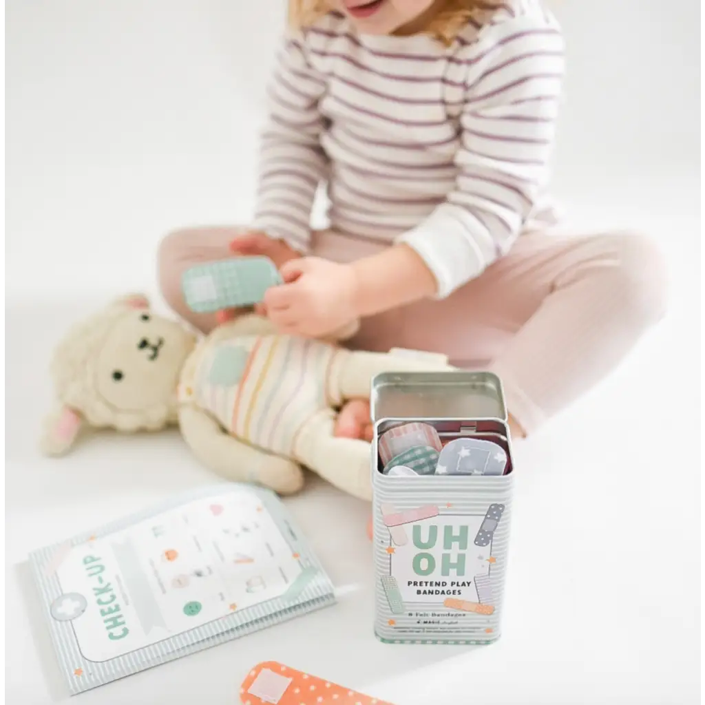 Mint-colored first aid kit with pretend play bandages and medical supplies