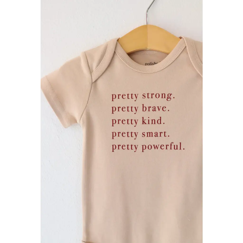 Beige Pretty Brave Organic Cotton Baby Onesie with empowering text for babies