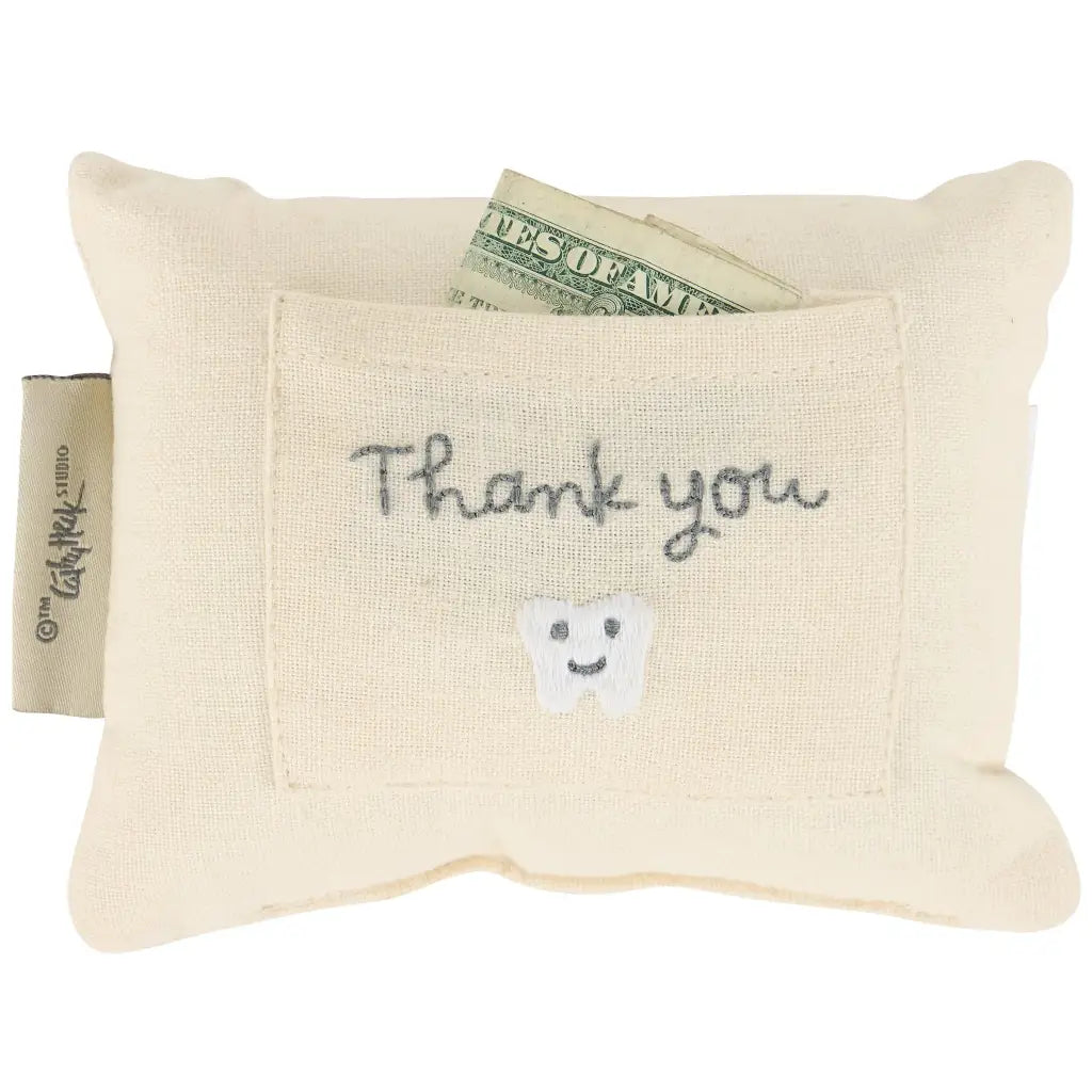 Cream-colored fabric tooth fairy pillow with pocket and embroidered happy tooth for fairy pillow