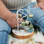 Baby’s bead maze toy with wooden base and bunny illustration, perfect as a rabbit bead maze