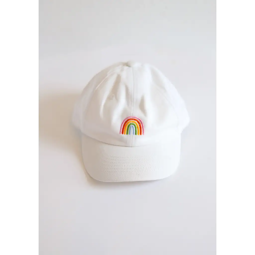 White kids ball cap with colorful rainbow patch, perfect for little adventures