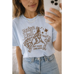 Light blue oversized unisex tee with cowboy graphic and raise hell but raise kind kids text