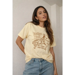 Oversized unisex tee with cowboy graphic and raise hell but raise kind kids text