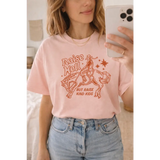 Oversized unisex tee with pink cotton cowboy print and raise hell but raise kind kids text