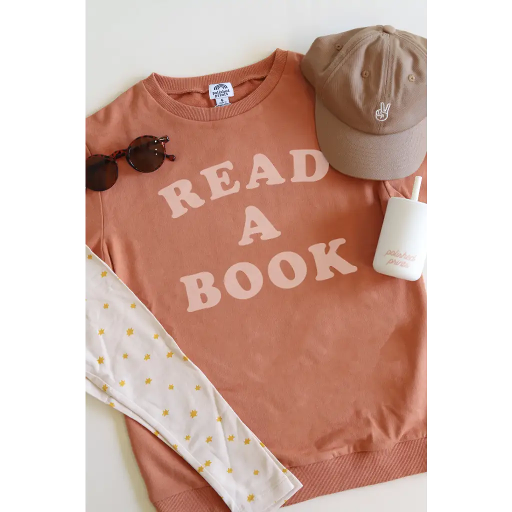 Terracotta organic cotton lightweight pullover with READ A BOOK in pink letters