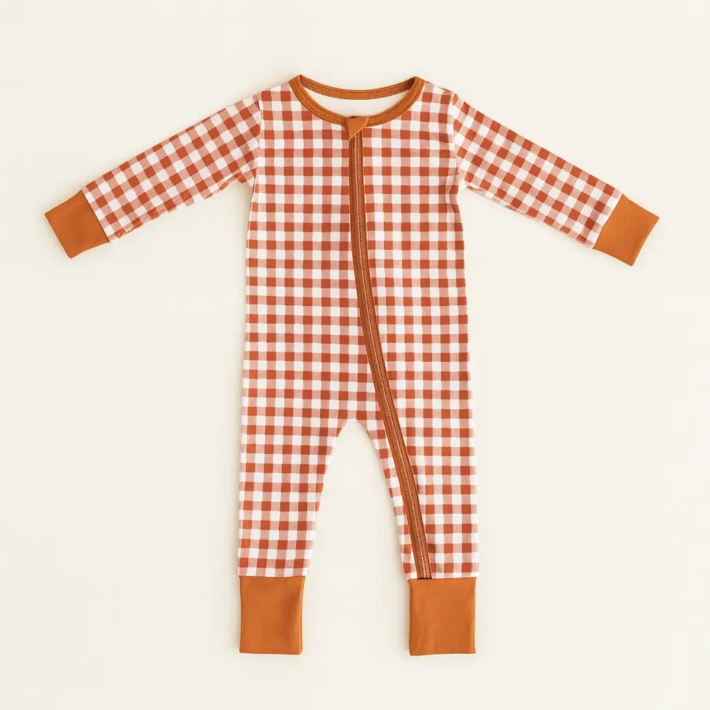 Infant’s red gingham bamboo baby sleeper with zippered footless design
