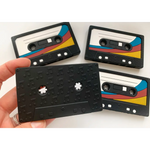 Black retro cassette tape teether with colorful stripes for baby’s teething relief