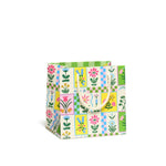 Retro Flower gift bags with floral prints, perfect for stylish womens clothes or clothes for moms