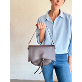 Brown leather Roxie Saddle Crossbody Bag, a must-have for stylish womens clothes