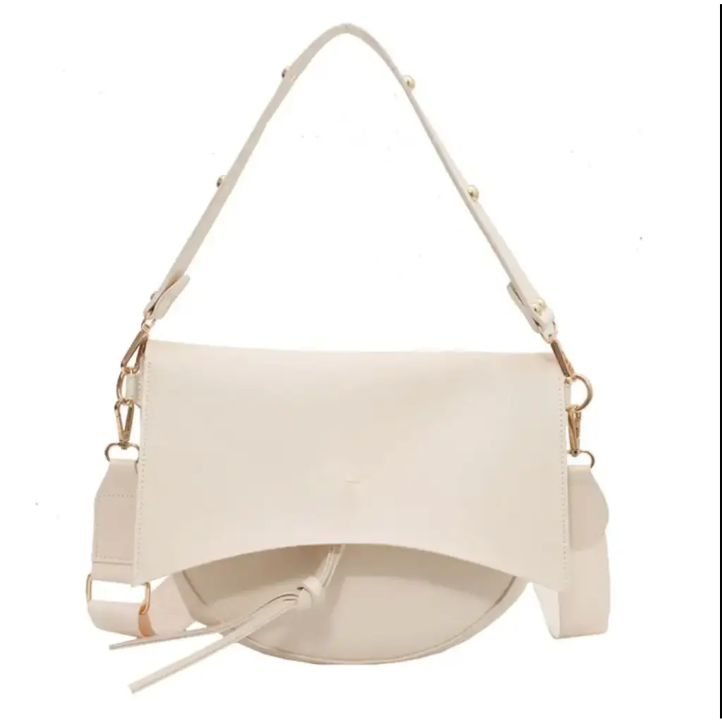 Cream-colored Roxie Saddle Crossbody Bag with adjustable straps for stylish womens clothes