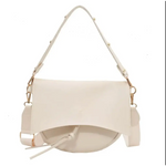 Cream-colored Roxie Saddle Crossbody Bag with adjustable straps for stylish womens clothes