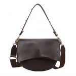 Brown leather Roxie Saddle Crossbody Bag perfect for stylish womens clothes and polished prints