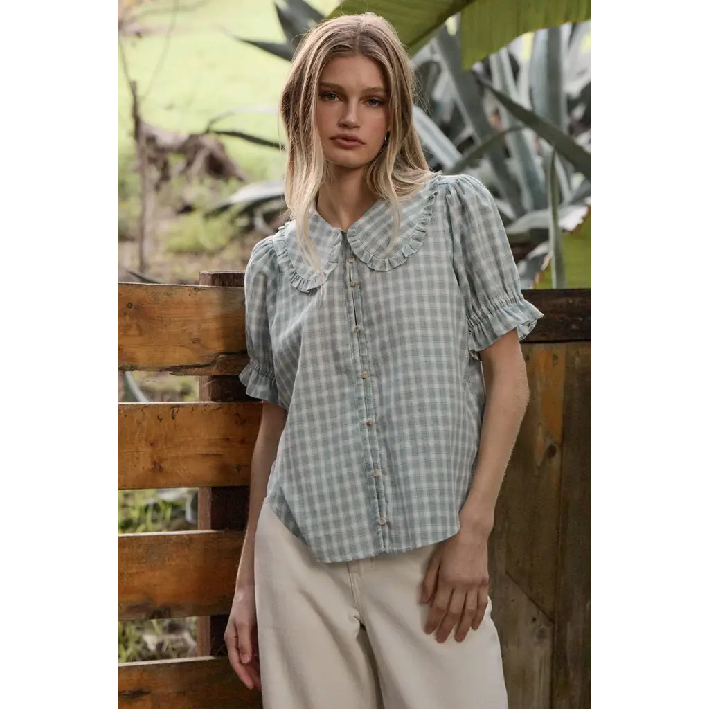 Light blue gingham blouse with soft ruffle collar and puffed sleeves