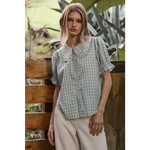 Light blue gingham blouse with soft ruffle collar and puffed sleeves