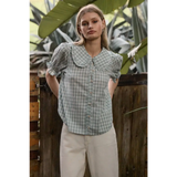 Light green gingham blouse with soft ruffle collar and puffed sleeves