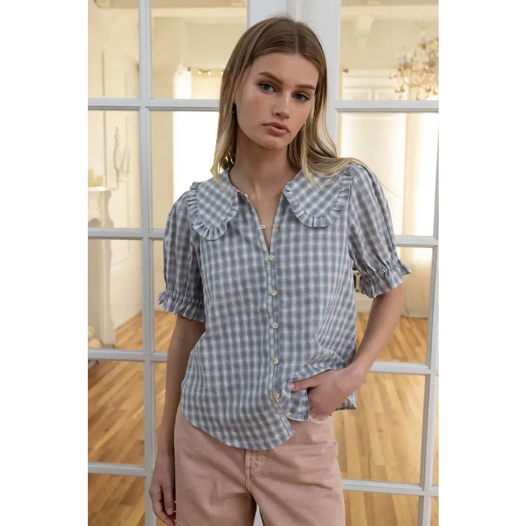 Light blue gingham blouse with soft ruffle collar and puffed sleeves