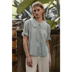 Light green gingham blouse with soft ruffle collar and puffed sleeves