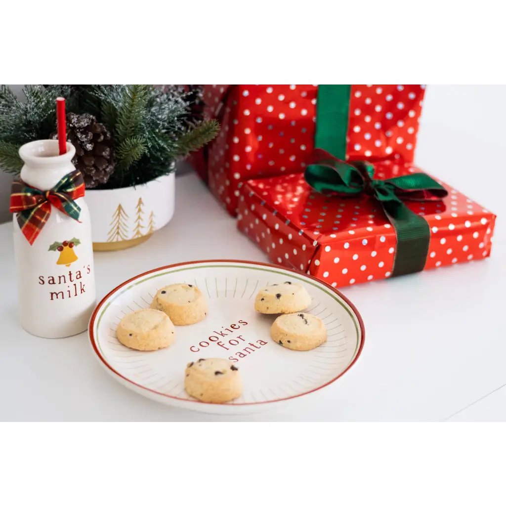 Red polka dot cookie plate with cookies for Santa and green bow