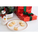 Red polka dot cookie plate with cookies for Santa and green bow