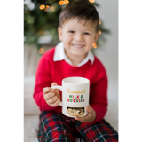 Santa’s Milk & Cookies mug with festive red green design, white handle