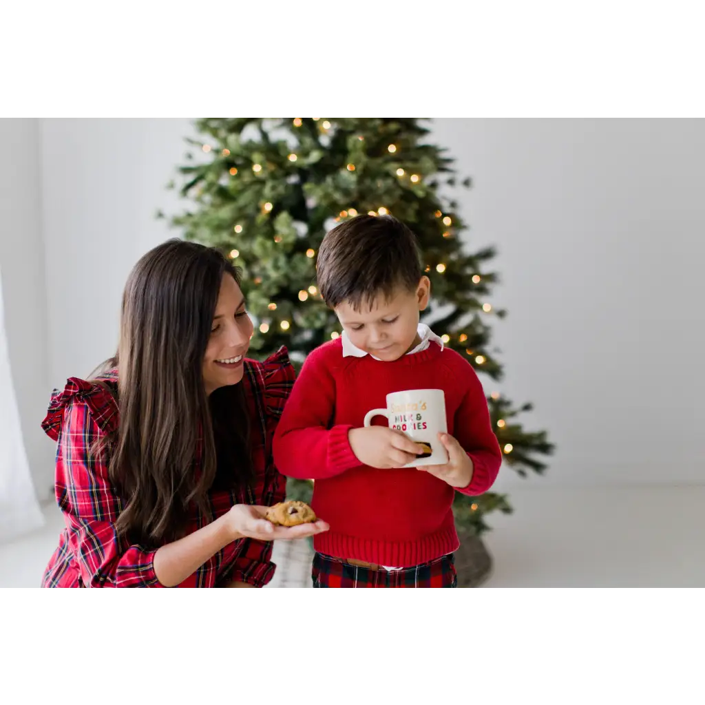 Festive red plaid pajama set with cookie slot mug display
