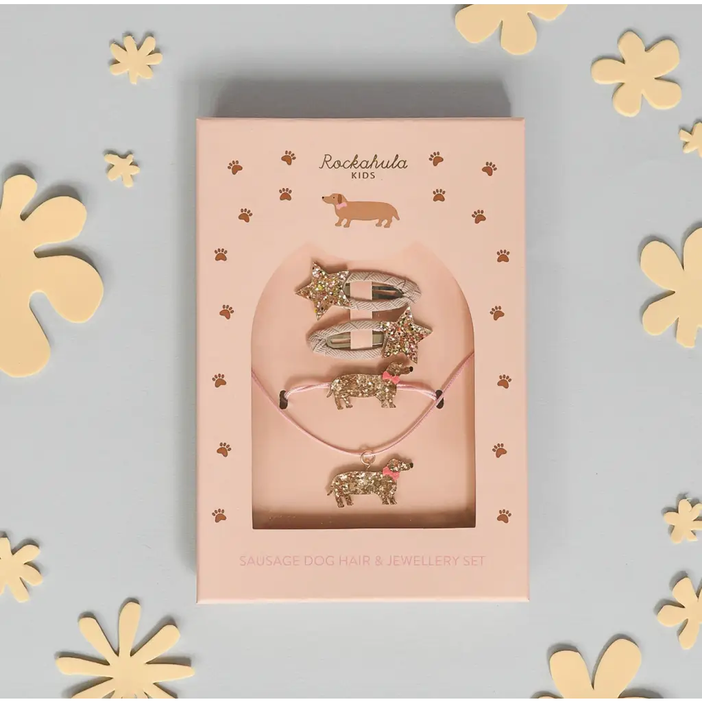 Pink hair clip card with glittery gold animal designs in a lovely gift box