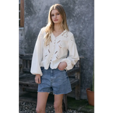 Scalloped floral cutout blouse with eyelet embroidery and puffed sleeves