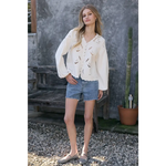 Woman in Scalloped Floral Cutout Button Blouse with eyelet embroidery