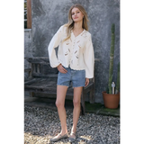 Woman in Scalloped Floral Cutout Button Blouse with eyelet embroidery