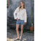 Woman in Scalloped Floral Cutout Button Blouse with eyelet embroidery